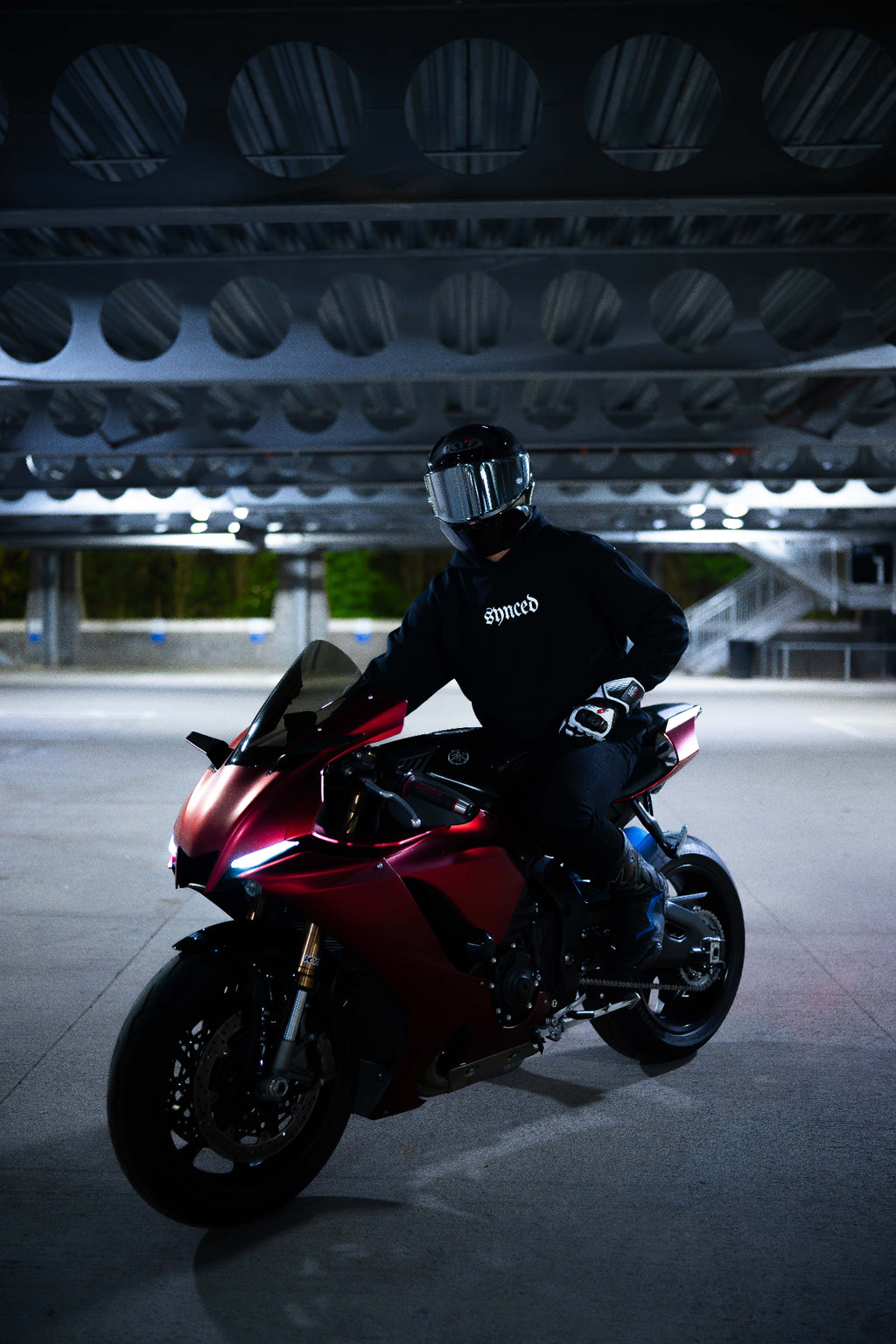 Synced Motorsports Core Hoodie front view on motorcycle