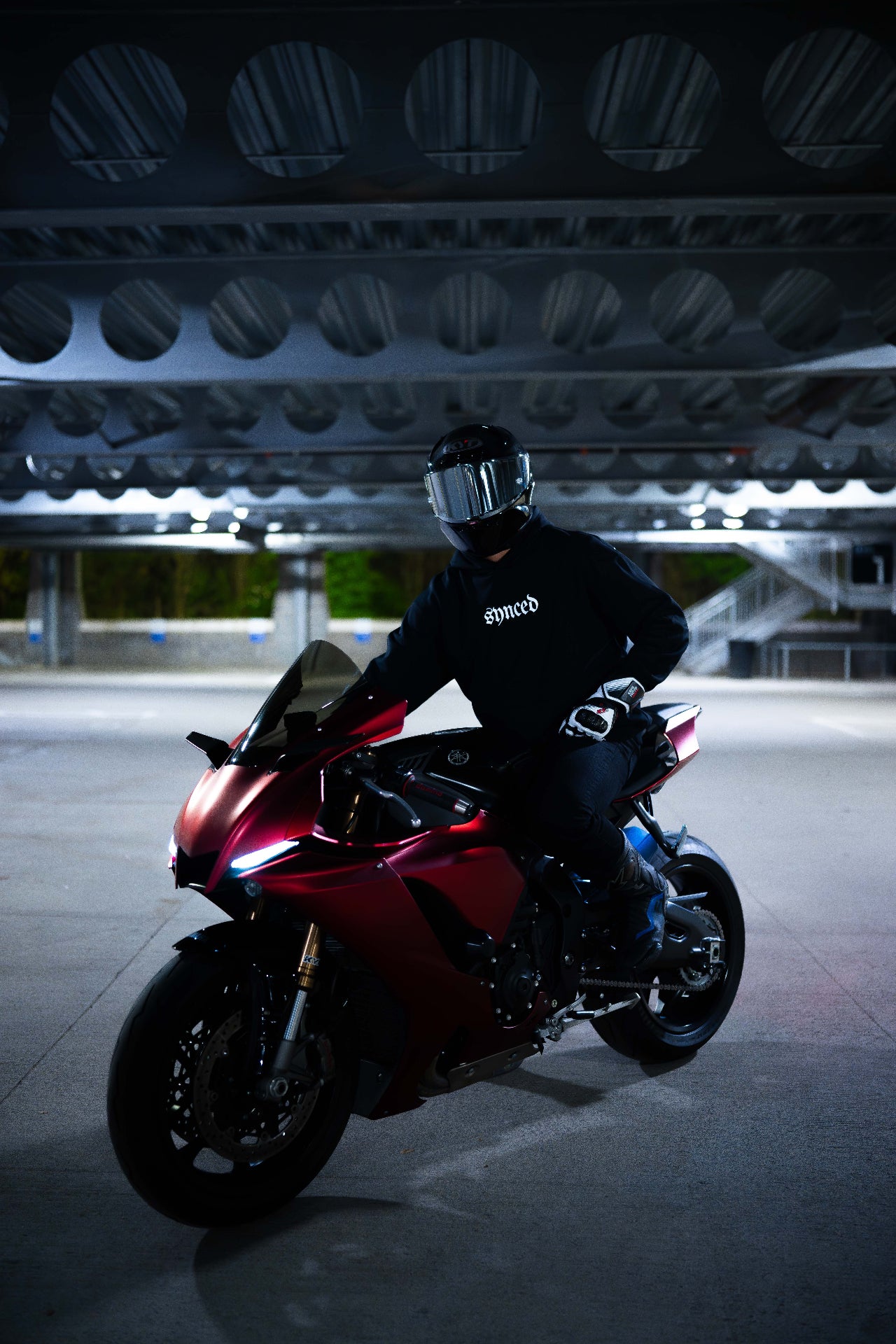 Synced Motorsports Core Hoodie front view on motorcycle