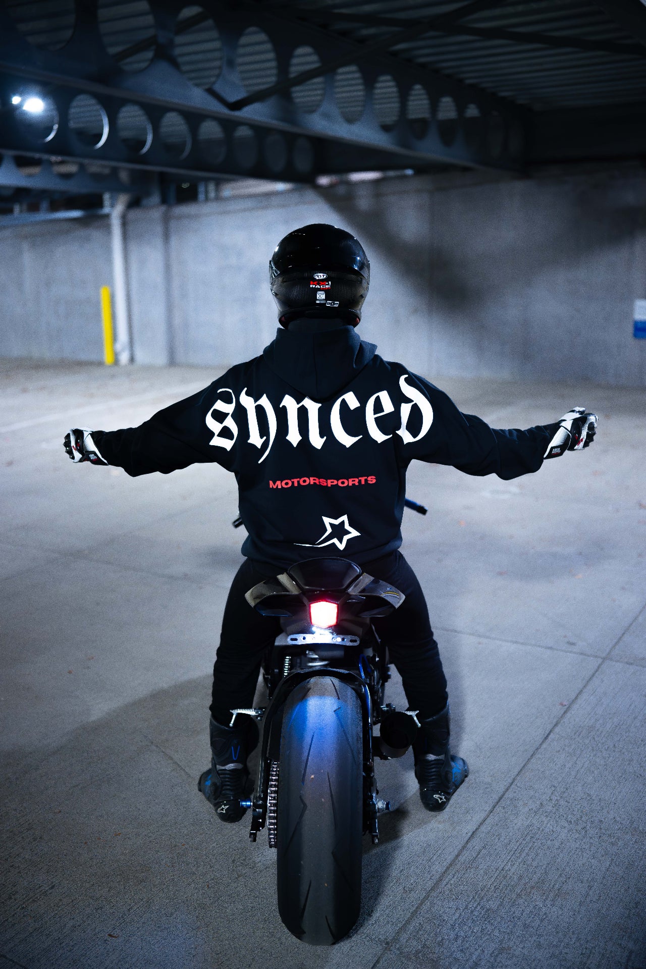 Synced Motorsports Core Hoodie full back view on motorcycle